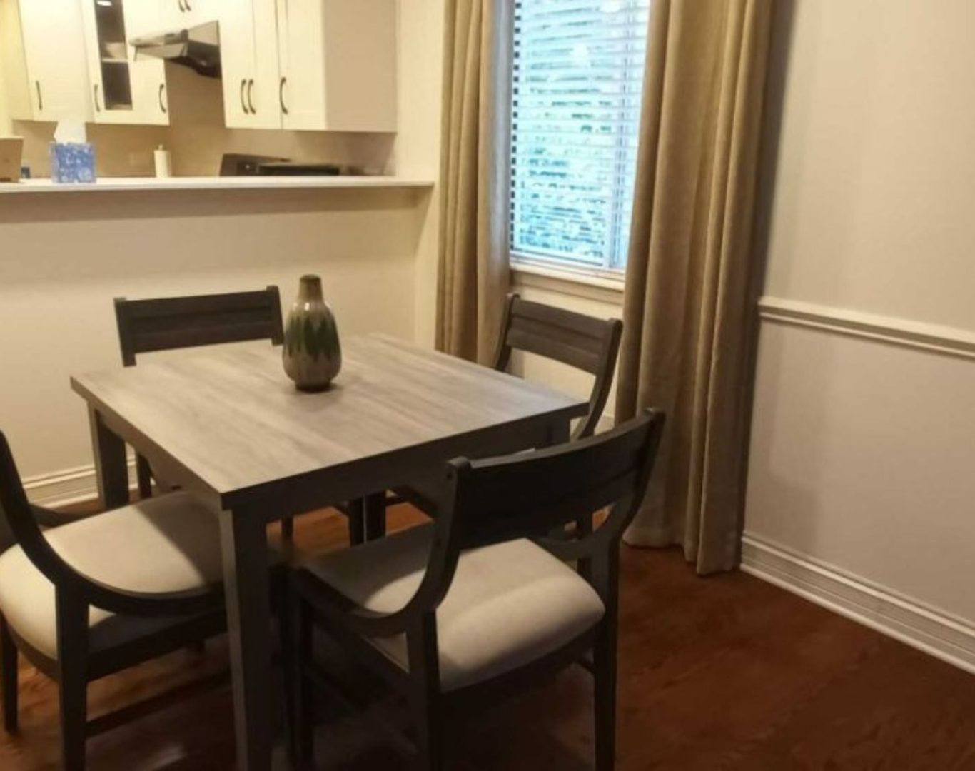 Stay Fresh Cleaning Services cleaner sanitizing and polishing a Cary, IL kitchen, demonstrating the benefits of hiring experienced local professionals