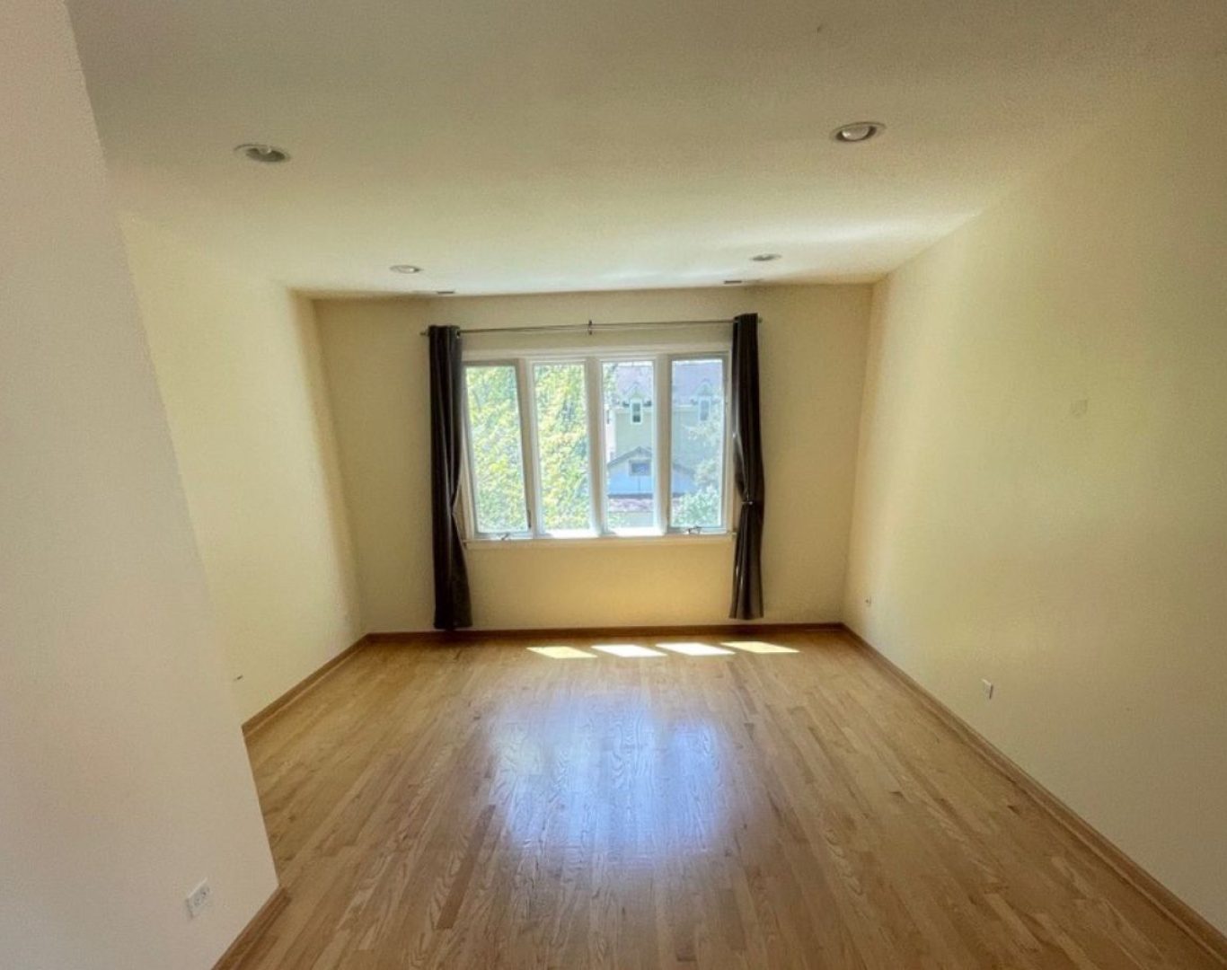 Cleaner finishing bathroom sink and mirror in occupied Mundelein townhome during routine visit